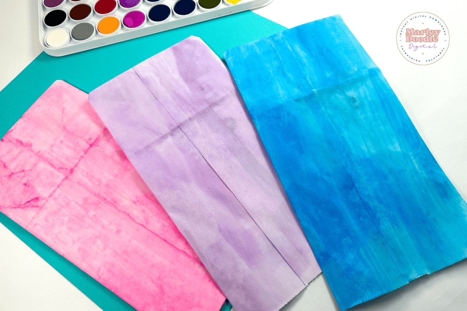 Painted paper bags ready for jellyfish craft project.