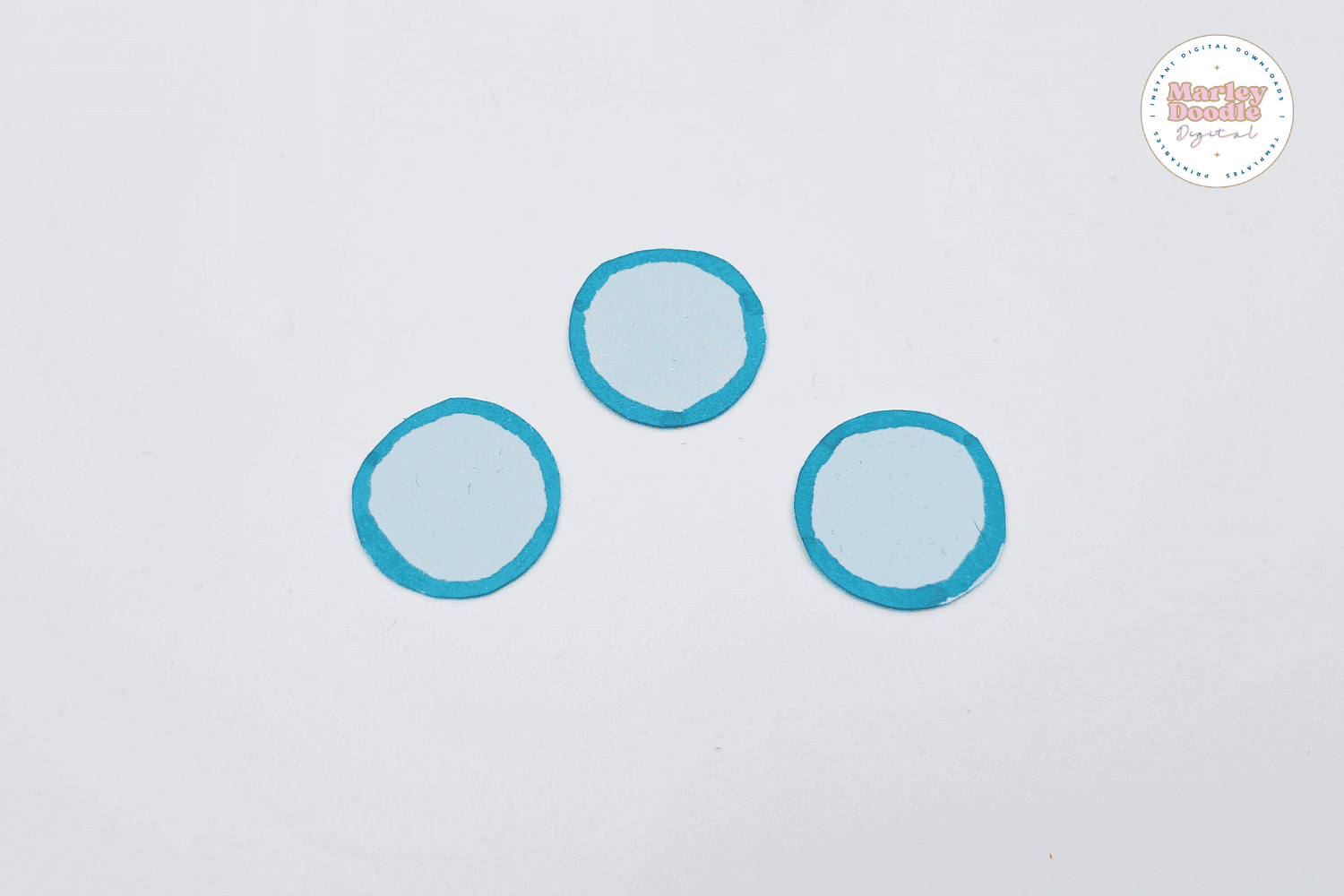 Blue outlined paper circles ready for boat craft.