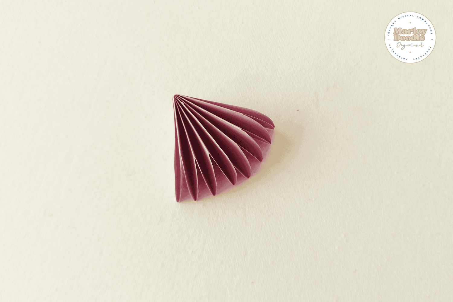 Completed pink paper flower fan for wreath craft.