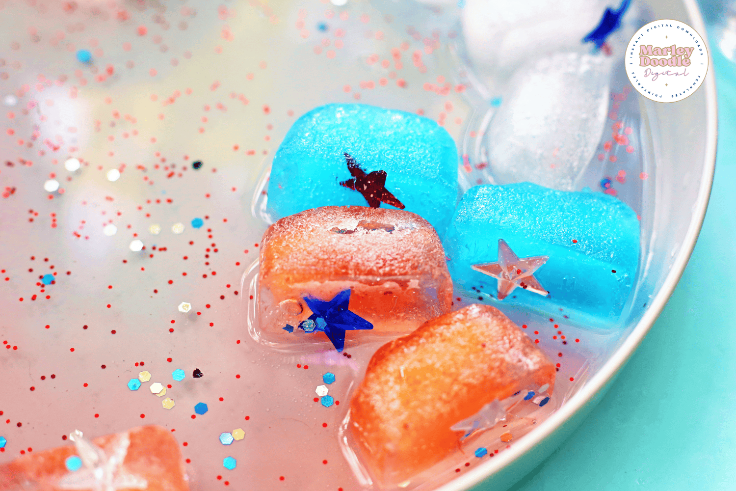 Melting patriotic ice cubes with glitter stars in water