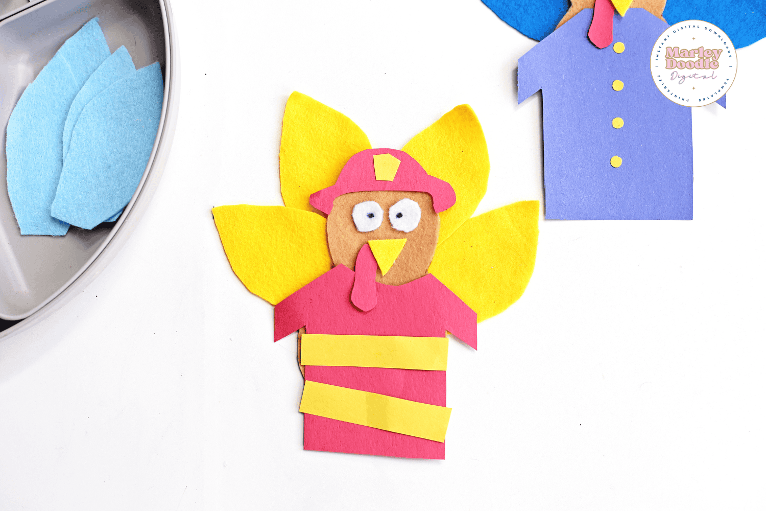 Felt turkey craft disguised as a firefighter with red uniform and yellow feathers