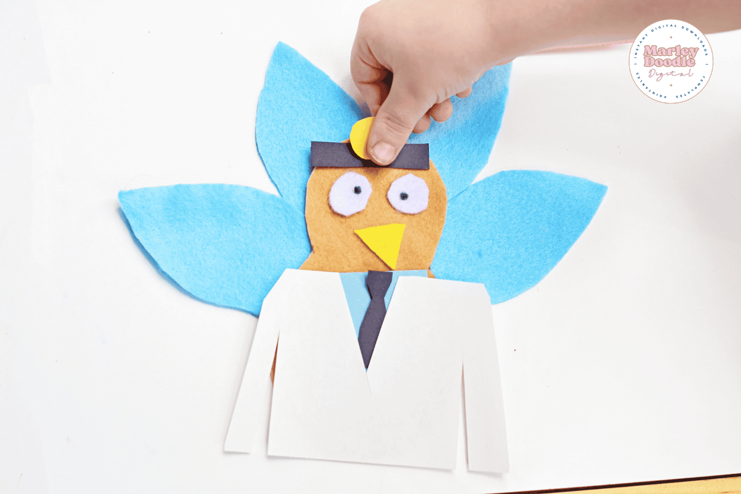 Turkey in disguise craft dressed as a doctor with blue feathers and white coat